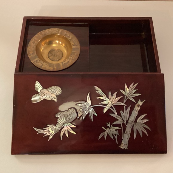 Vintage lacquered smoking box with mother of pearl inlay.